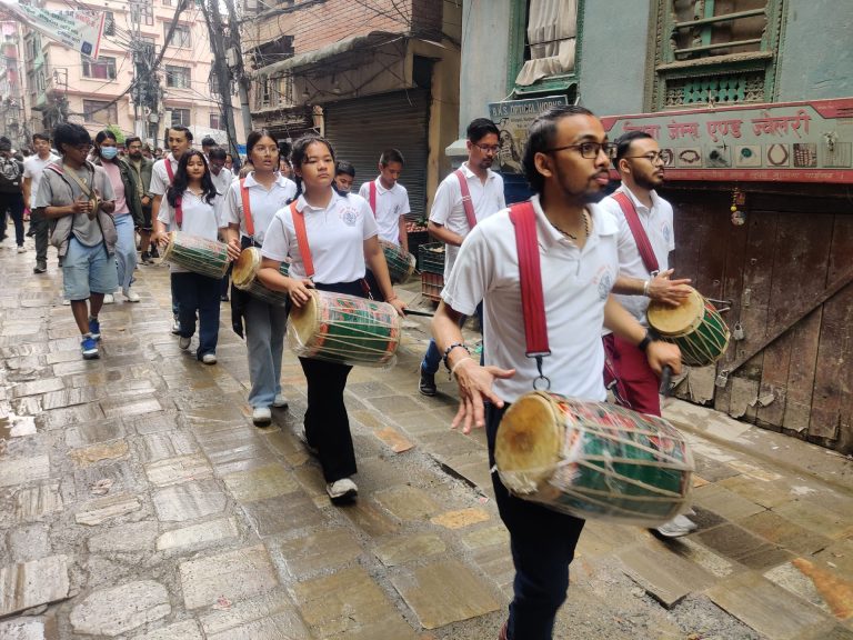 Young children are playing the traditional instrument called Dhaa